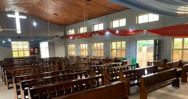 Rows of hardwood pews installed across the nave of an Anglican church in Ogun State